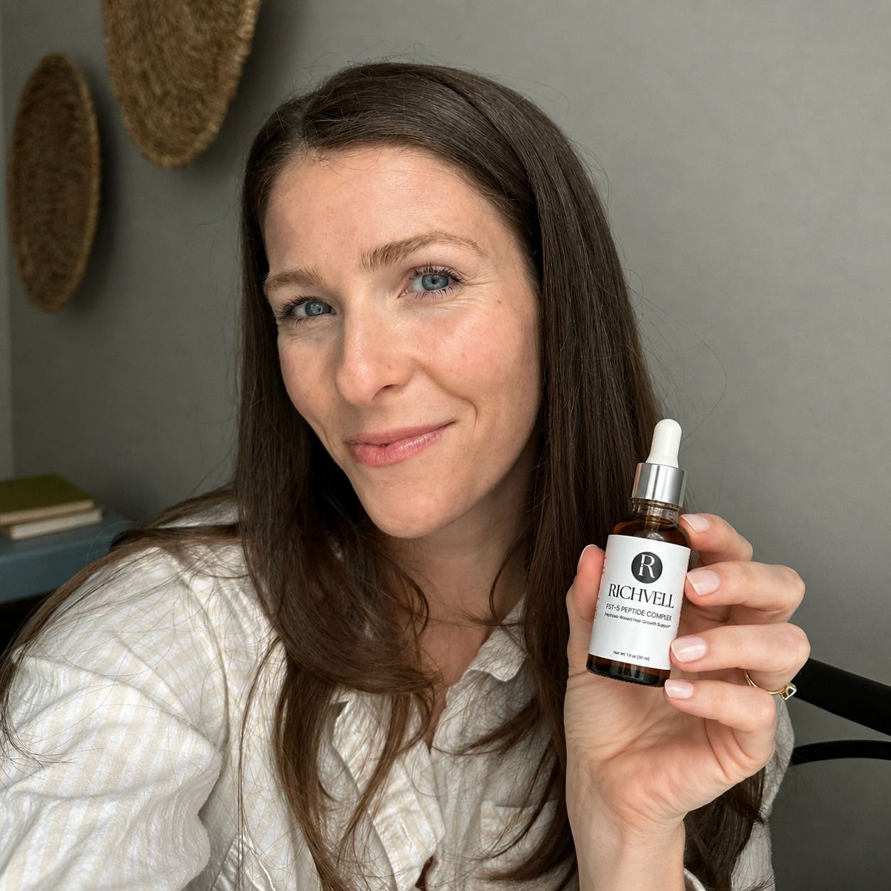 A woman holding the FST-5 Peptide Complex